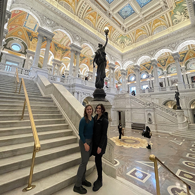 Kellie and Maddie stand together and pose with the impressive interior of the Library of Congress in the background. Click to enlarge.