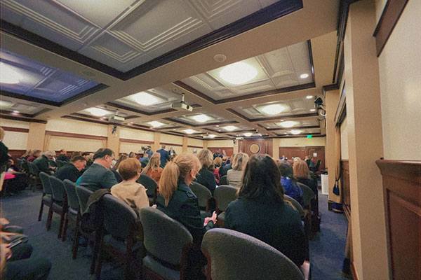 A large group of people sitting in a hearing room, listening to the legislative hearing on House Bill 93 about school choice.