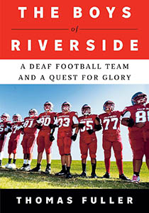 Book cover with an image of a group of football players. They are all wearing their equipment and standing arm in arm on the field. A red rectangle above them features white text that reads, The Boys of Riverside. A Deaf Football Team and a Quest for Glory