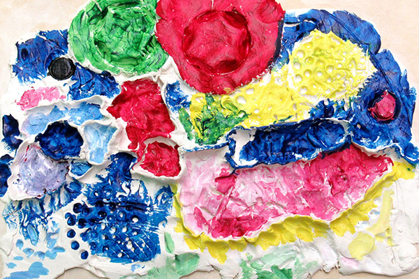 Caroline's clay art piece showing different bright colors and textures. Click to enlarge image.