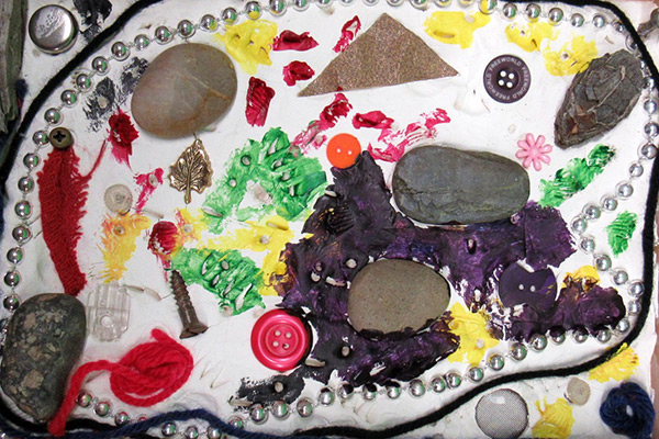 Johanna's clay art piece featuring different colors, textures and materials. Click to enlarge image.